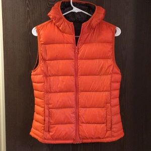 Women’s size M orange packable down vest.